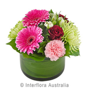 Round Glass Vase of Pink and White Blooms